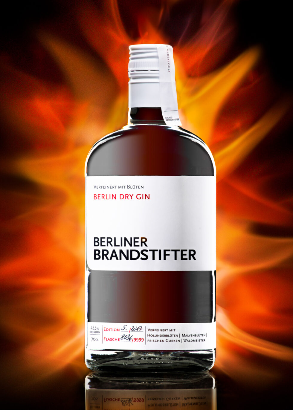 Product photo of a gin bottle with flames