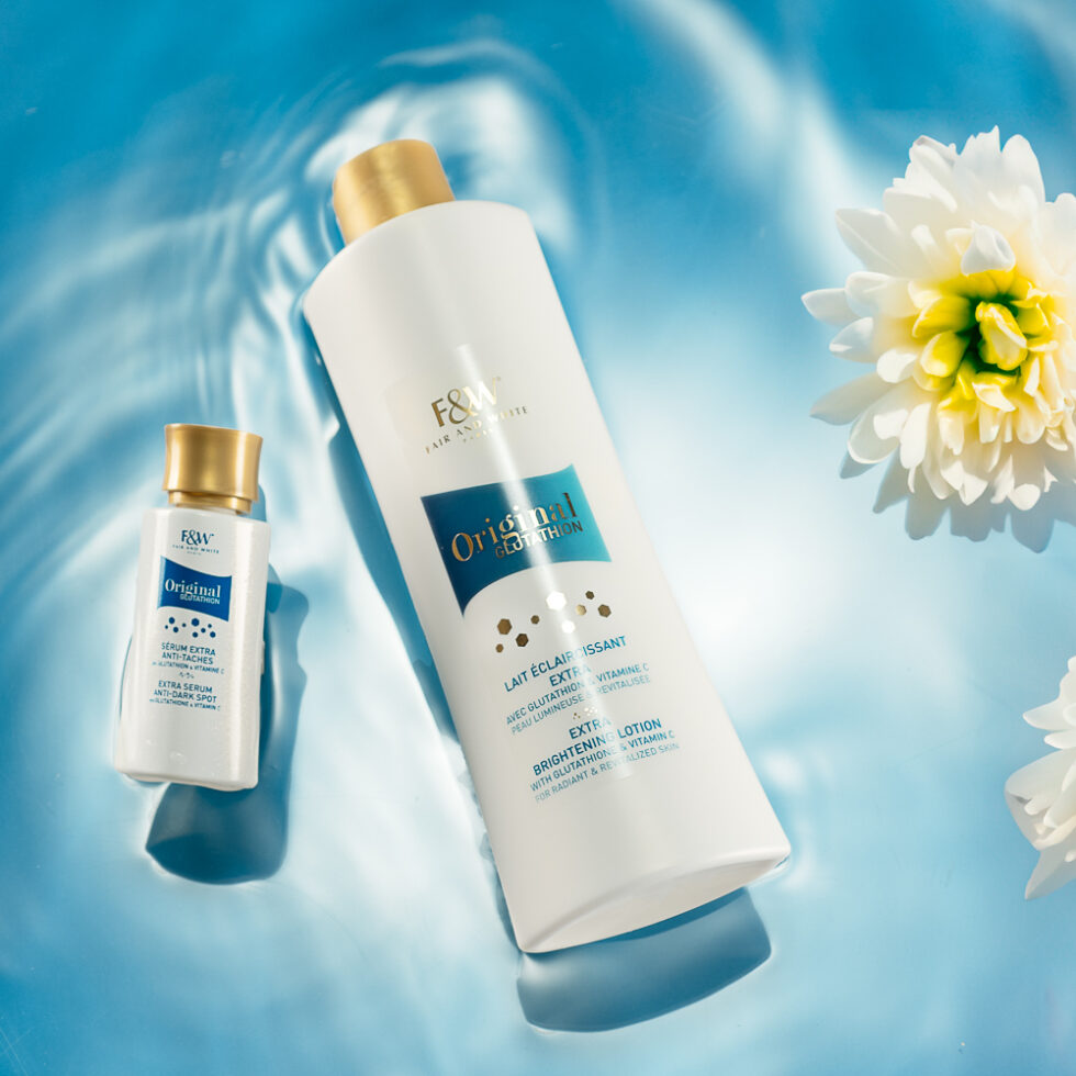 Advertising photography of two cosmetics bottles flowing with flowers