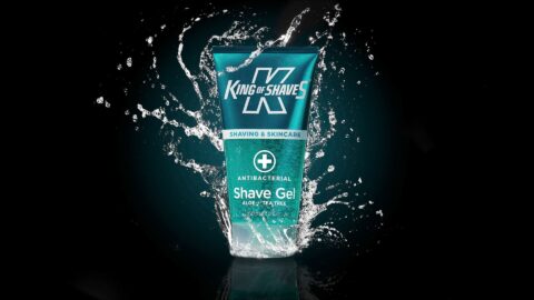 Product photo of a bottle of shaving gel with splashes