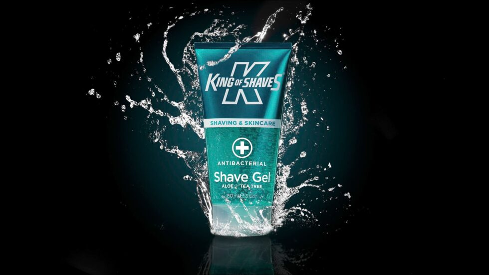 Product photo of a bottle of shaving gel with splashes