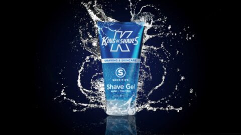 Product photo of a bottle of shaving gel with splashes